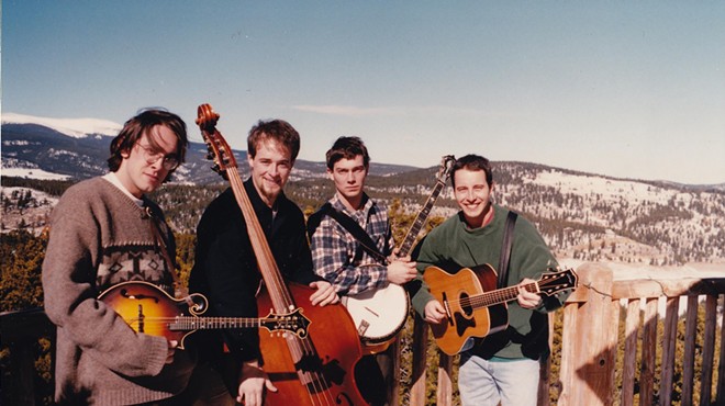 bluegrass band poses with mountain backdrop