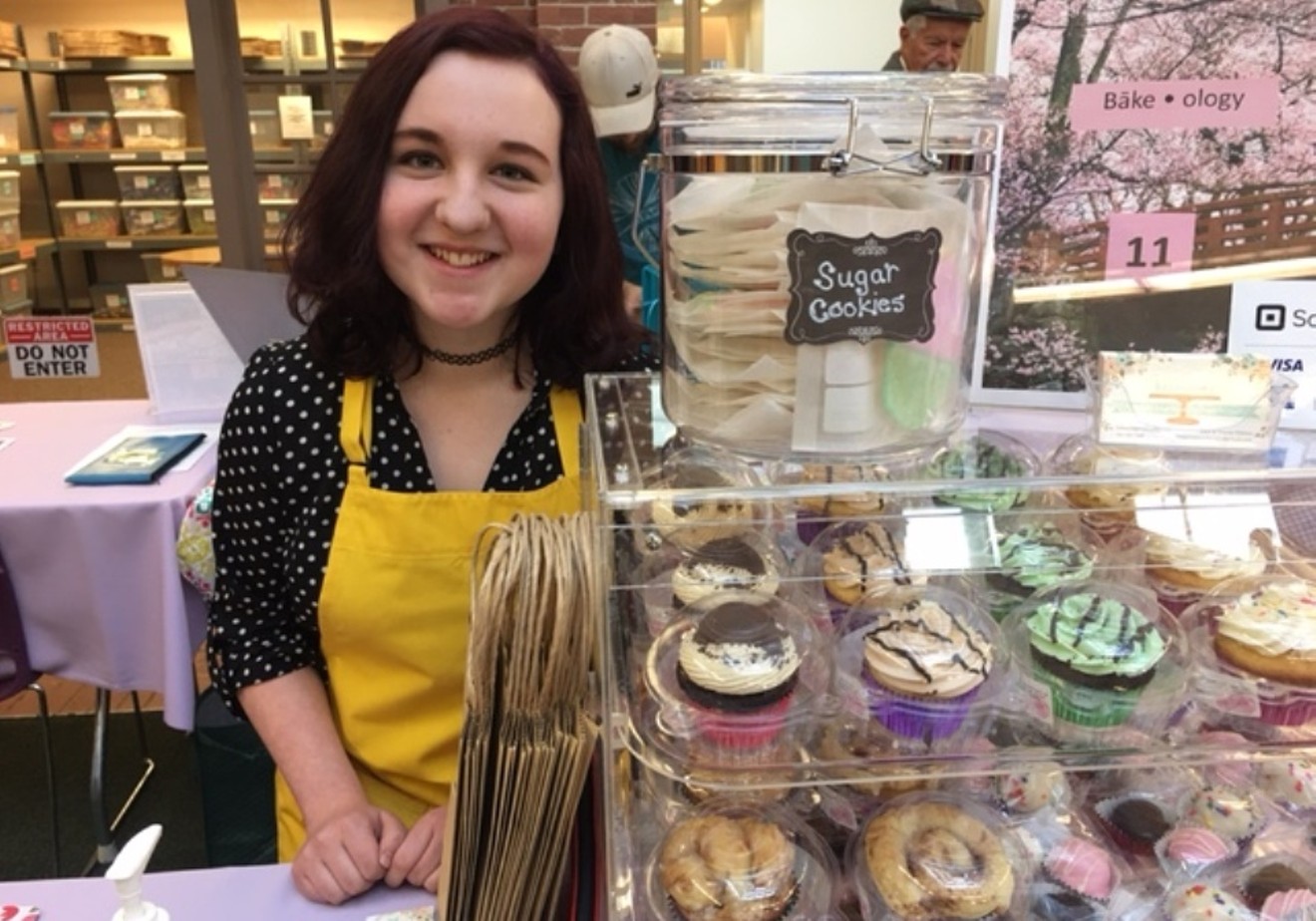 Rain Adams sells her baked goods at the YouthBiz Marketplace.
