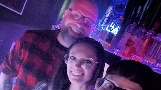 Jillian Johnson standing with two of her employees