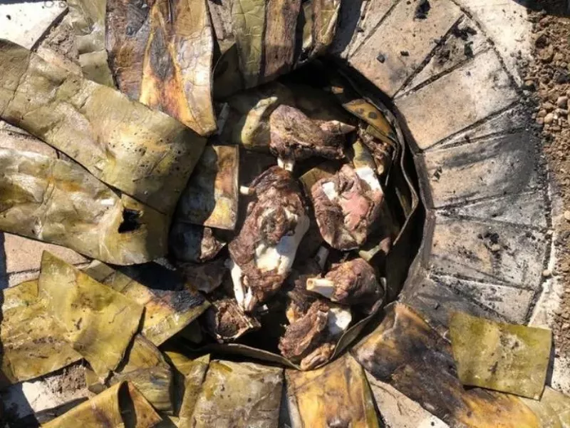 Image: Whole lamb, including las cabezas, are cooked n a brick-lined hoyo by El Borrego Negro.