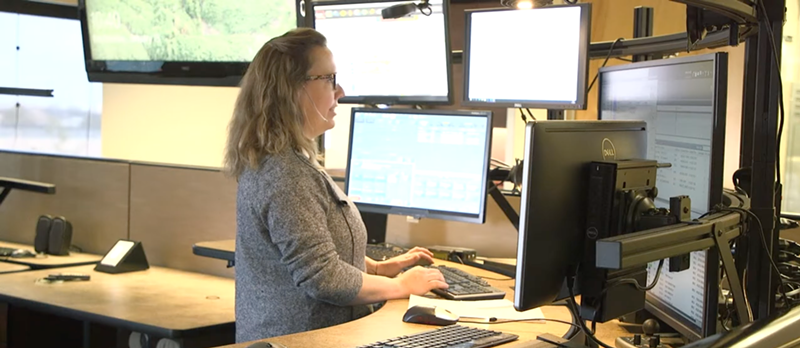 Image: woman answering 911 calls