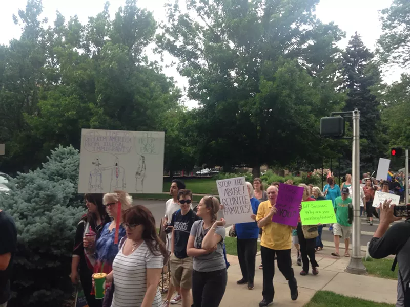 Image: Protesters march from the Montview Boulevard Presbyterian Church to Temple Micah on Thursday, June 14.