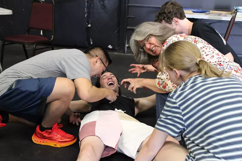 Image: Actors rehearse a zombie play.